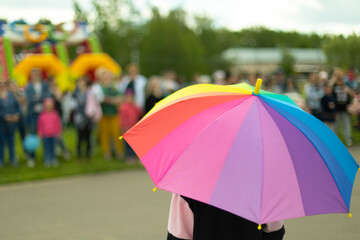 Colored umbrella in summer. Party on street.