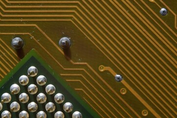 microprocessor on the background of the microcircuit of the motherboard.