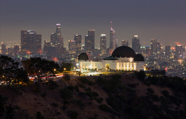 Fourth of July fireworks over Griffith Observatory with the Los Angeles skyline in the distance