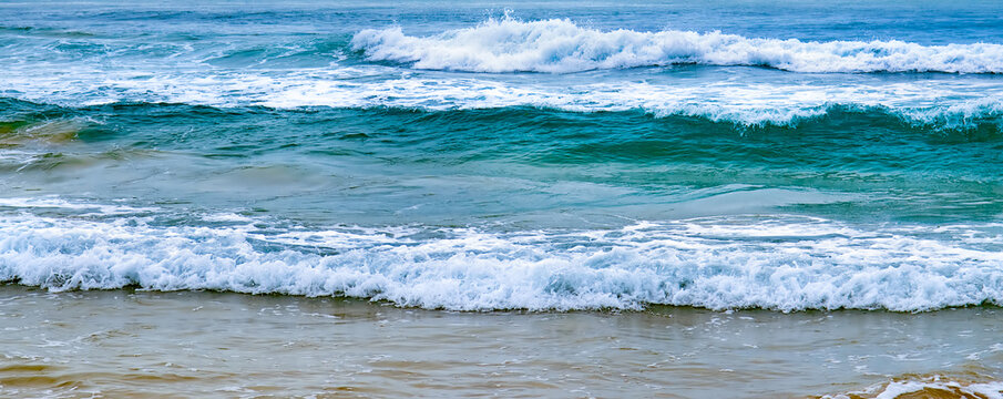 Abstract blue sea water with wave for background. Wide photo.