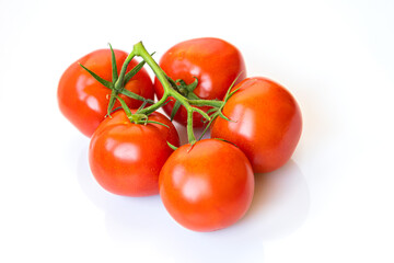 Bunch of ripe fresh tomatoes on a white background