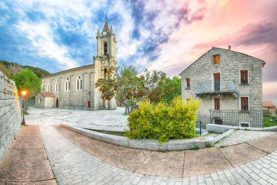 Majestic evening cityscape with Parish Church of the Assumption  in Zonza village