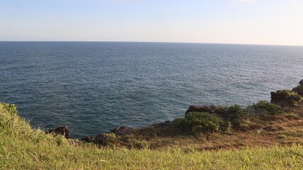 person walking on a cliff
