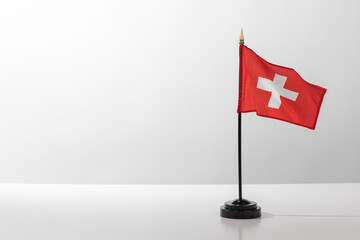 Flying Country Flag Switzerland isolated on white table with grey background