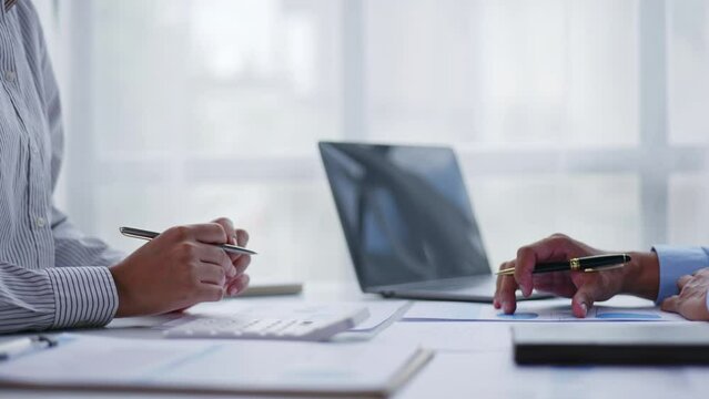Close up of sale and client hands calculate the price for selling and buying hame. 