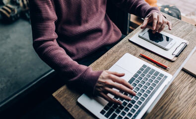 Skilled male copywriter working remotely with ideas for web publication and text creating content...