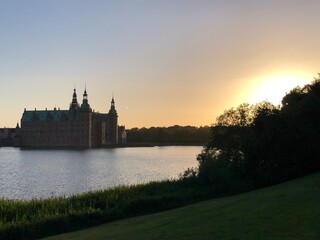Fototapeta premium castle on the lake in the sunset