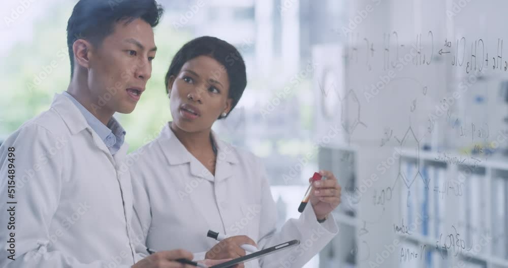 Leinwandbilder Scientists using a digital tablet while brainstorming equations and formulas on a glass wall in a lab. Focused pathologists and researchers analyzing data and research while developing a theory