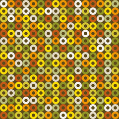 Seamless background with small multicolored rings.