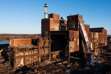 Fototapeta na wymiar Aerial of Rusted and Basic Oxygen Furnace and Caster Undergoing Demolition at Sunset - Abandoned Armco Steel / AK Steel Ashland Works - Russell and Ashland, Kentucky