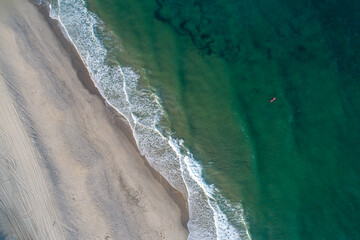 zenithal aerial view of a beach shore, summer concept