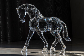 Crystal horse on a dark background	