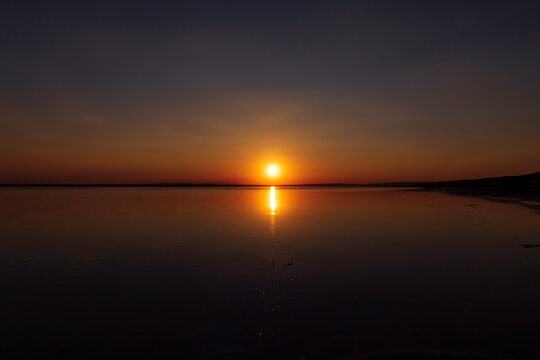 Sunset or sunrise over the lake. Sundown on the horizon. Nature background photo
