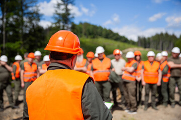 Helmet builder. Many construction workers helmet. Engineer team in hardhat for work. Worker group...