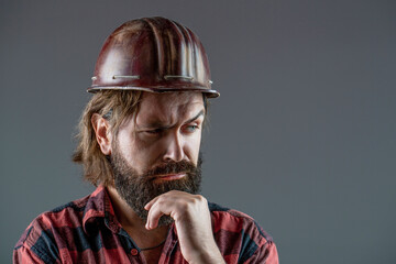 Bearded man worker with beard in building helmet or hard hat. Builder in hard hat, foreman or...