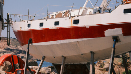 Old sailing yacht in the dock for repairing