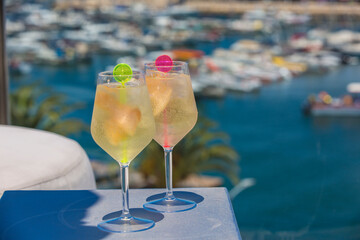 Two Cocktail drinks over looking a marina, Roof top bar
