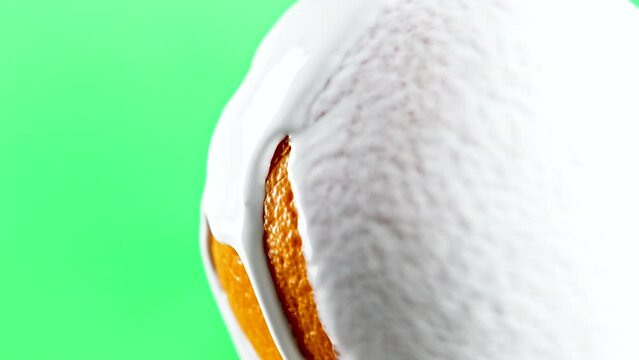 Green background. Stock clip.Fresh oranges on which sugar white mousse is poured.