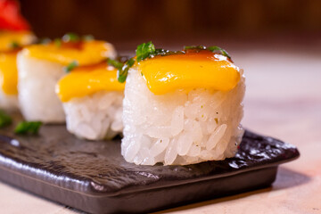 japanese dish rice rolls with cheese close-up
