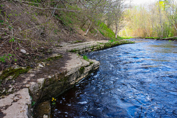 A small rapid river in a limestone canyon