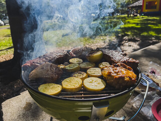 There is meat on the grill. Barbecue for the holiday. American Weekend. Soft focus