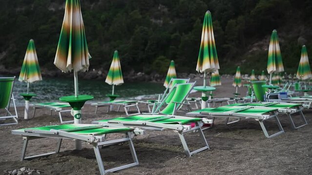 Sun loungers and umbrellas on the Sassolini beach.