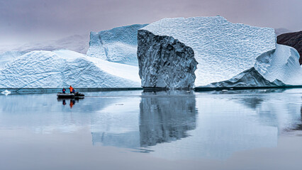 Title: Zodiac travels past a massive Iceberg in Scoresby Sound Greenland