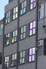 Side of a Building with Colour Reflected in the Windows