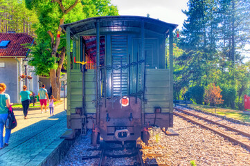 Visitors at train station during ride with old train at Mokra Gora, Serbia.