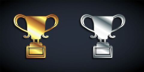 Gold and silver Award cup icon isolated on black background. Winner trophy symbol. Championship or competition trophy. Sports achievement sign. Long shadow style. Vector