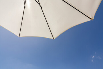  parasol under clear blue sky