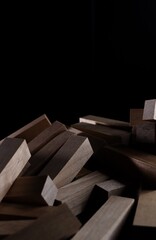 Stack of wooden blocks .Jenga on a black background.