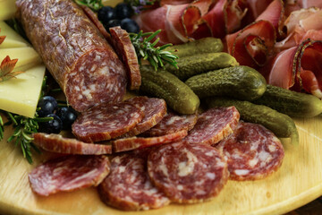 Typical food of the Dolomites with salame, ham, salame, puccia and honey