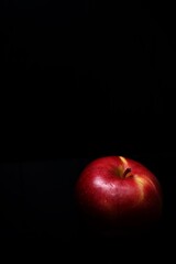 red apple on black