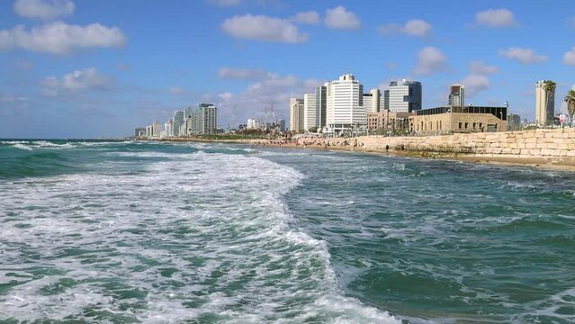 Scenic Tel Aviv coastline seashore promenade with hotels and beaches near Old Jaffa port.