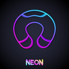 Glowing neon line Travel neck pillow icon isolated on black background. Pillow U-shaped. Vector