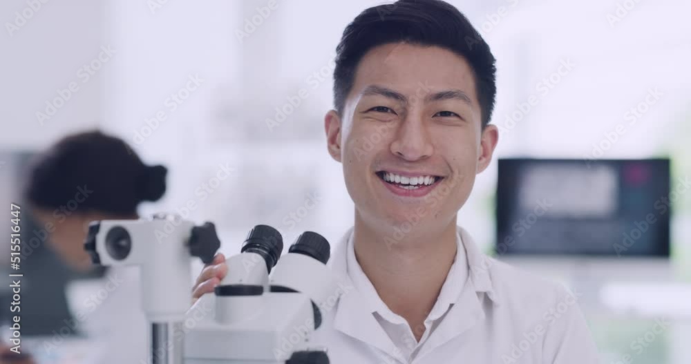 Poster a male scientist in a research lab using a microscope. portrait of a happy young biologist or biotec