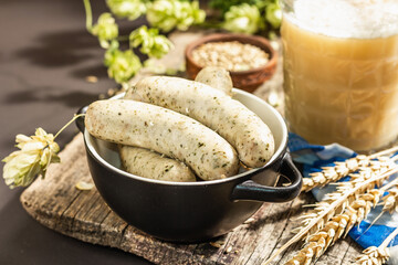 Oktoberfest set. Unfiltered beer, weisswurst, spikelets of grain, hop