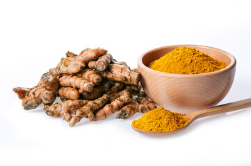 Turmeric powder in wooden bowl with turmeric root and spoon isolated on white background.