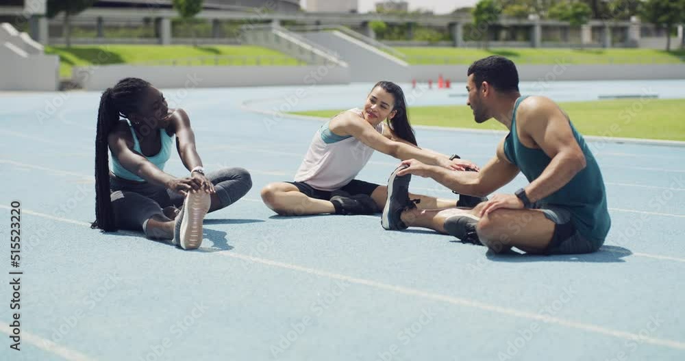 Sticker Diverse group of marathon runners talking while getting ready for a race in a stadium. Young athletes stretching their legs as a warmup exercise to prevent injury during training on a sports track.