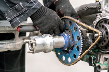 mechanic repair the karting engine in workshop