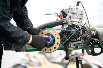 mechanic repair the karting engine in workshop - obrazy, fototapety, plakaty