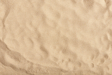Natural texture: top view of beach sand, clear, clean and smooth. Minimalist background for summer...