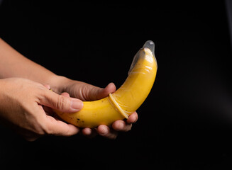 condom, hand hold banana with condom