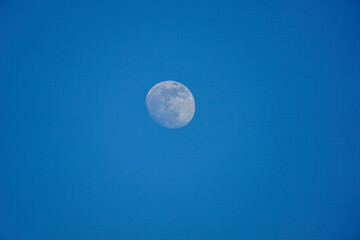 Moon against the dark blue sky