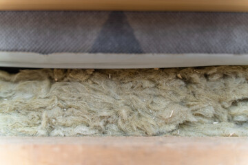 Roof insulation with mineral wool, close-up. Mineral wool between cladding and roof