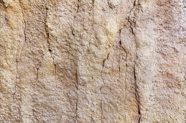 Craggy rock surface texture background. Rough brown rock surface background.