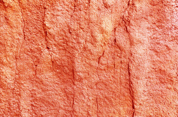 Craggy rock surface texture background. Rough red rock surface background.