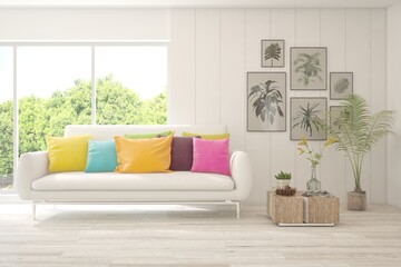 White living room with sofa and summer landscape in window. Scandinavian interior design. 3D illustration