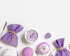 Fragrant healthy spa products with essential oil, bath bombs and sea salt, lavender sachet bag on...